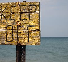 Keep Off- warning on the rocks of Lake Michigan by Piper Patterson