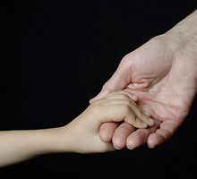 Senior woman holding little girl's hand by Sami Sarkis