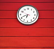 White clock on Red wall by nuttakit