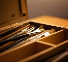 Paintbrushes in paint box by Flaxmadeus