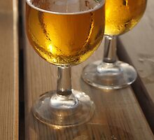 Beer Glasses on Wooden Table by jojobob