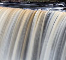 Over the Edge - Upper Tahquamenon Falls, Michigan by Kenneth Keifer