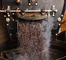 Coffee roaster pouring beans by sumners