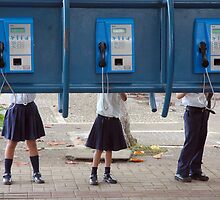 Communication! - School children play with public phone in Costa Rica by Eyal Nahmias