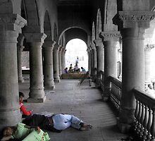 A couple visiting a cenotaph in Indore falls asleep while the child looks on ,fiddling with a cell phone by nisheedhi