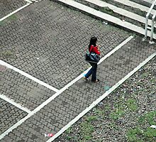woman walking alone by bayu harsa
