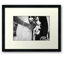 Bride and groom holding black and white wedding photograph Framed Print