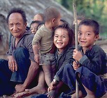 Hmong man with a bunch of grandchildren. Thailand by John Spies