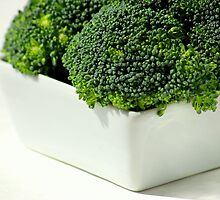 Fresh, green broccoli by Suzanne Edge