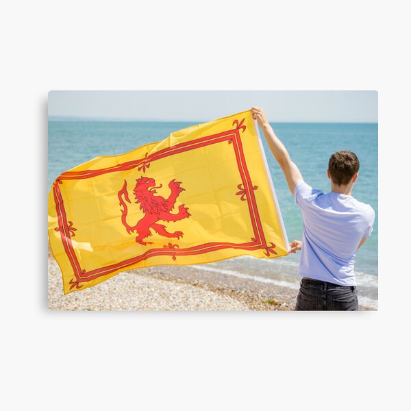 A young man with a Lion Rampant of Scotland flag Canvas Print