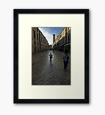 Child wandering along Stradun, Dubrovnik, Croatia Framed Print