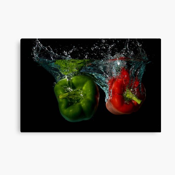 Green and Red Bell Sweet Peppers Dropped Into Water Canvas Print