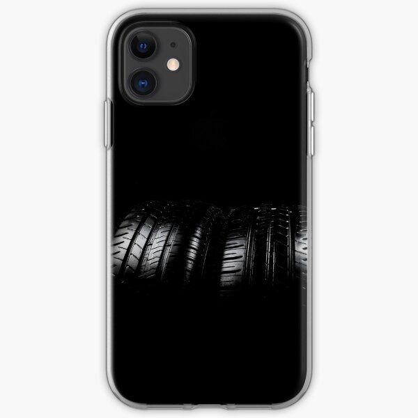 Close up view of car tyres isolated on a black background iPhone Soft Case