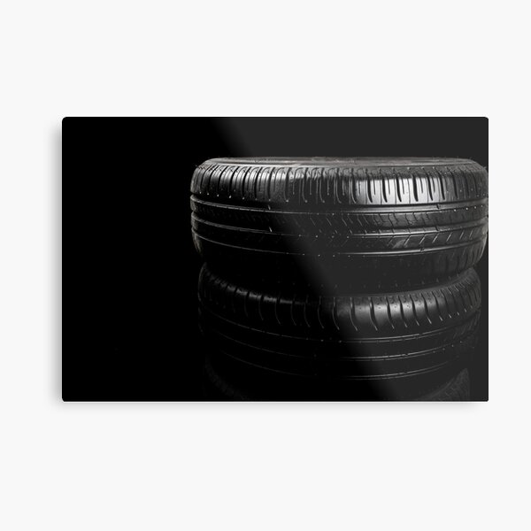 Close up view of car tyres isolated on a black background Metal Print