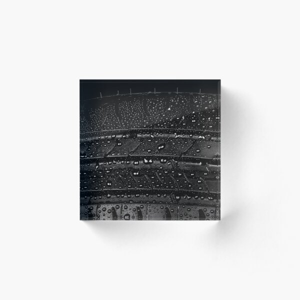 Car tyre isolated on a black background Acrylic Block