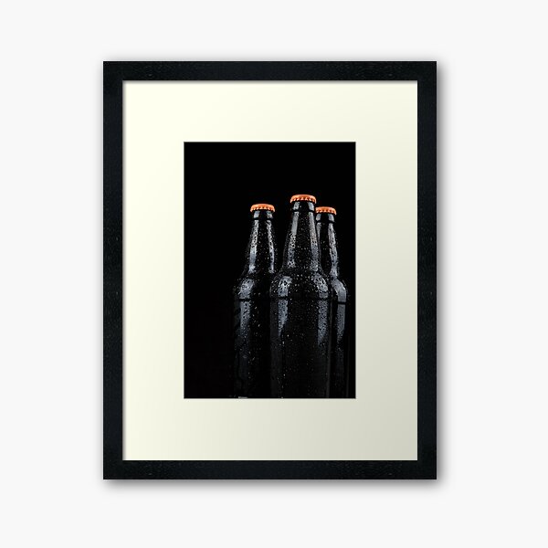 Bottles of beer with water droplets isolated on black background Framed Art Print