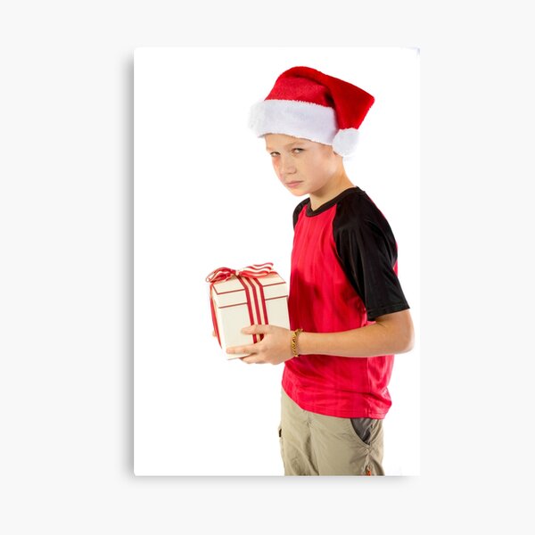 Pre-teen boy with a christmas gift Canvas Print