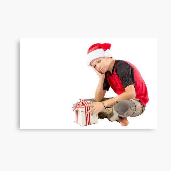 Pre-teen boy with a christmas gift Canvas Print