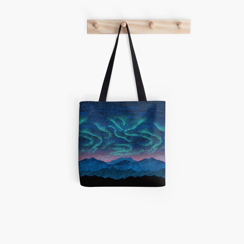 Aurora borealis over mountains Tote Bag