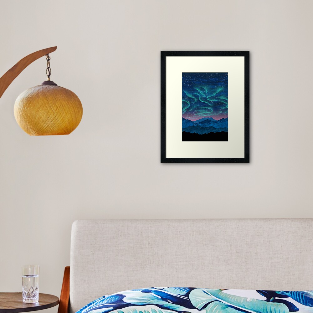 Aurora borealis over mountains Framed Art Print
