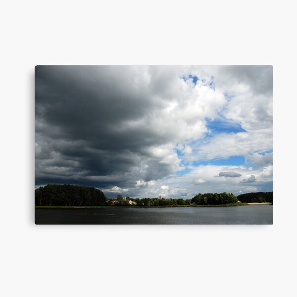 Clouds, lake and town Canvas Print