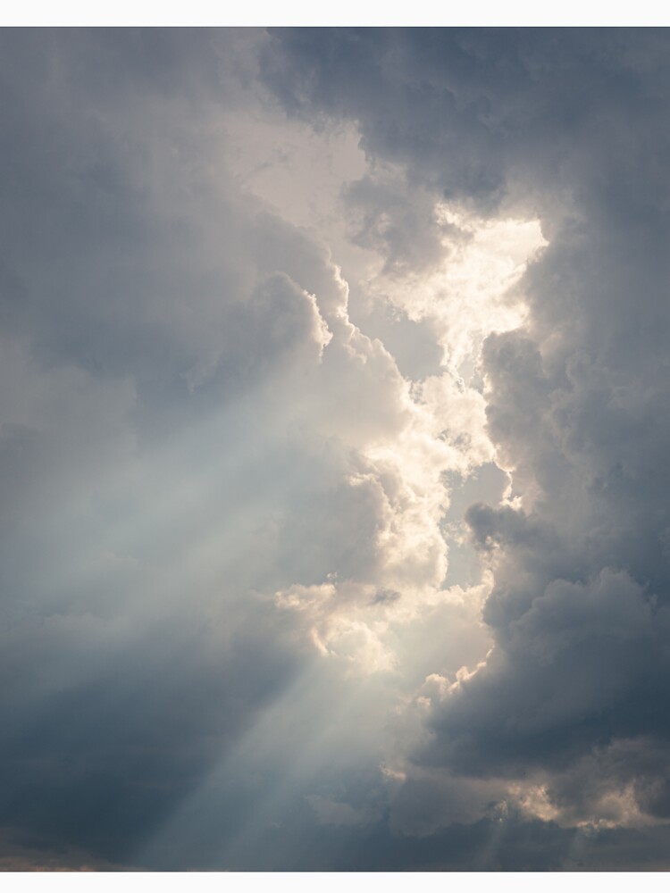 Sunbeam between storm clouds cloudscape by Juhku