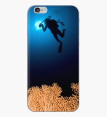 Underwater photograph of a diver swimming above an Anella Alcyonacea (soft corals) coral iPhone Case