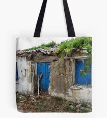 Fix a few slates and paint the door then it will be as good as new !! Tote Bag
