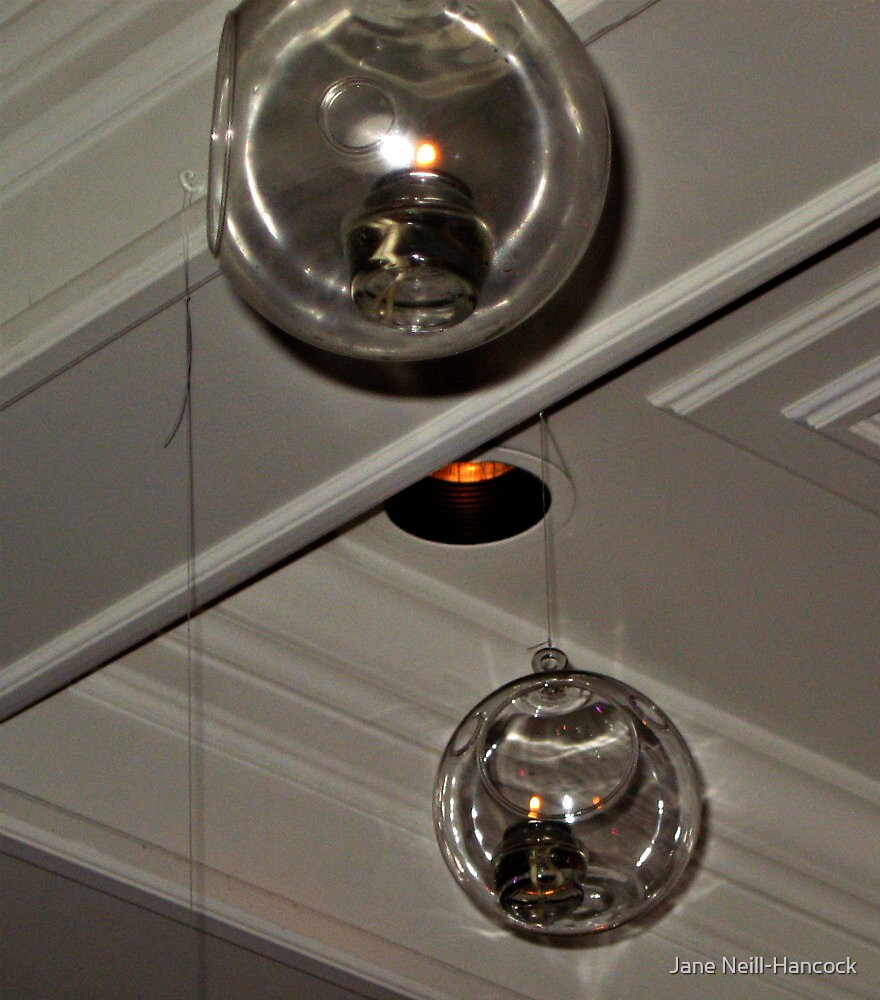 "Glass Globes Hanging From the Ceiling With Oil Lamps Inside" by Jane