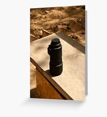Nikon zoom lens on a stone bench Greeting Card
