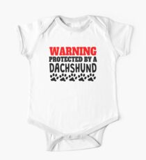 Protected By A Dachshund One Piece - Short Sleeve