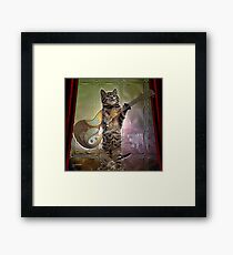 Cat playing guitar Framed Print