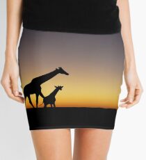Giraffe silhouettes at sunset Mini Skirt