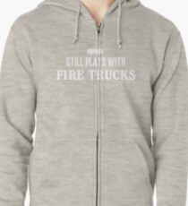 Still plays with firetrucks Zipped Hoodie