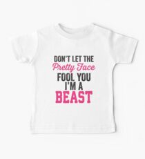 Don't Let The Pretty Face Fool You I'm A Beast (Pink) Baby T-Shirt
