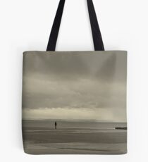 Iron man solitary figure on beach Tote Bag