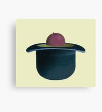 A single plum floating in perfume served in a man's hat Canvas Print