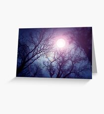 Dark enchanted photo of a full moon in the trees branches background. Blue and violet fairy-tale colors Greeting Card