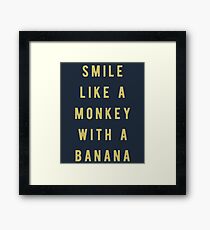 Smile like a monkey with a banana Framed Print