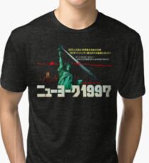 1997. New York City is now a maximum security prison. Breaking out is impossible. Breaking in is insane. Tri-blend T-Shirt