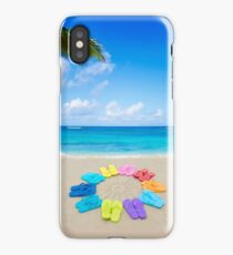 Color flip flops and drawing sun on sandy beach iPhone Case