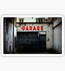 Old abandoned garage with red sign in historical center of Strasbourg Sticker