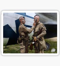 Filthy Thirteen member Clarence Ware applies war paint to Charles Plaudo. England, 31 December 1943. Sticker