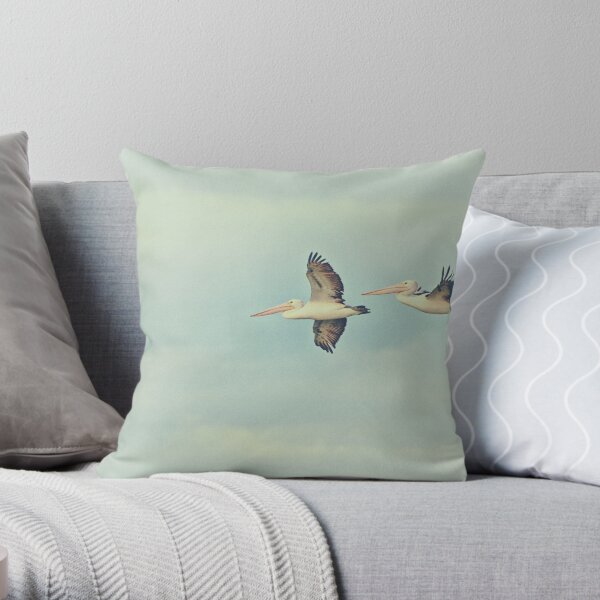 Pelicans in flight Throw Pillow