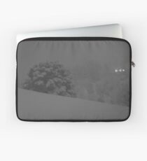 a snowy hill. Laptop Sleeve