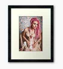 Freaky young woman in vintage corset Framed Print