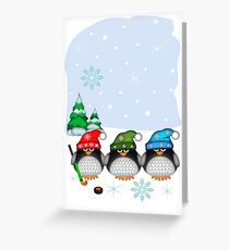 Hockey Penguins with snowflakes hats in a snowy landscape Greeting Card