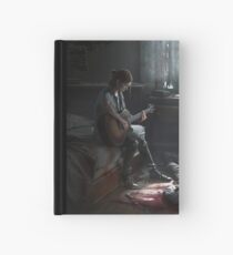 Ellie playing guitar Hardcover Journal