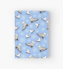 Seamless pattern with skates, snowflakes on a blue background. Vector Illustration. Hardcover Journal