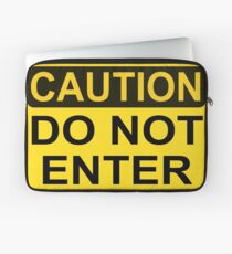 CAUTION: Do not enter Laptop Sleeve